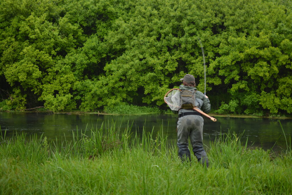 An angler fishing Big Spring Creek on a guide trip