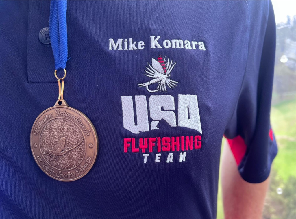 Mike Komara with a World Fly Fishing Championship Medal