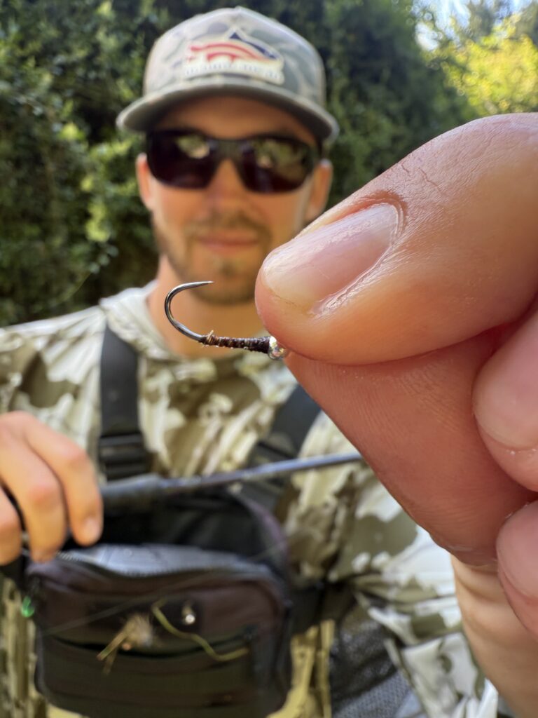 Author Mike Komara with a hook bent out by a giant brown trout in New Zealand