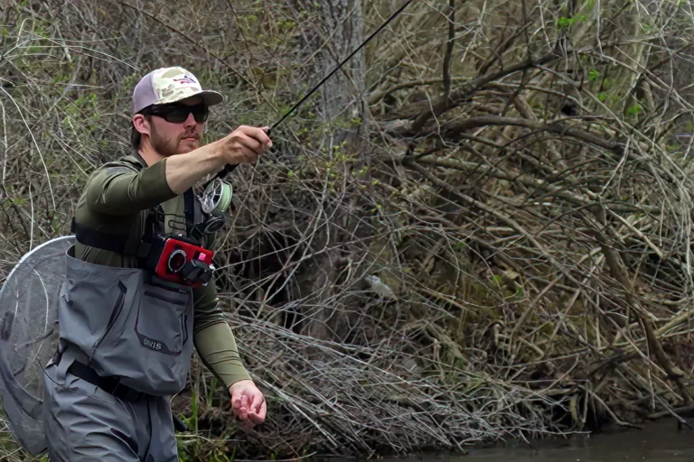 An angler doing the euro nymphing technique known as the pitch cast